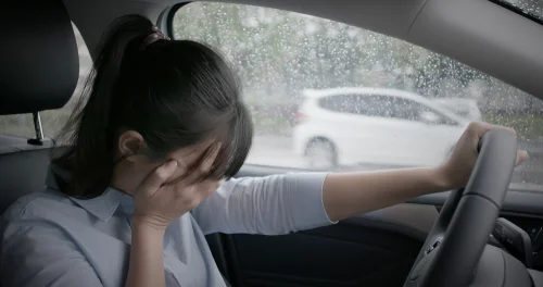 distressed_driver_after_rainy_weather_car_accident_bakersfield